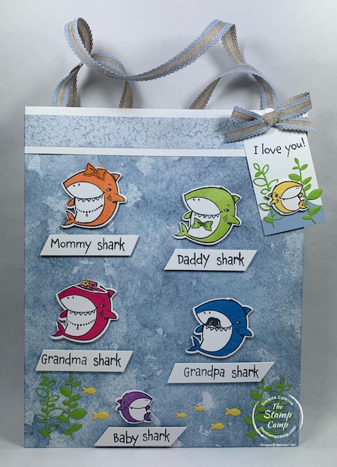 How would you like to create a Baby Shark Gift Bag and Tag to match the gift that is inside? Well today I have just that project for you with this bag and tag featuring the Shark Frenzy stamp set from Stampin' Up! Inside the fun bag is a Baby Shark Coloring Book and Baby Shark Hair clips. #thestampcamp #stampinup #babyshark