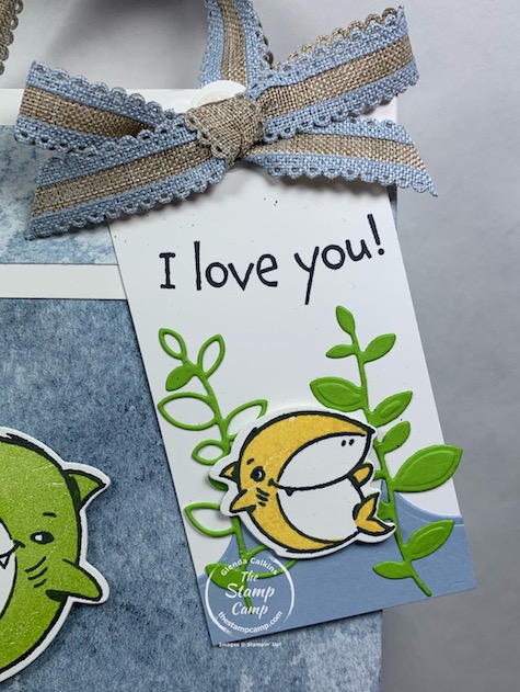How would you like to create a Baby Shark Gift Bag and Tag to match the gift that is inside? Well today I have just that project for you with this bag and tag featuring the Shark Frenzy stamp set from Stampin' Up! Inside the fun bag is a Baby Shark Coloring Book and Baby Shark Hair clips. #thestampcamp #stampinup #babyshark
